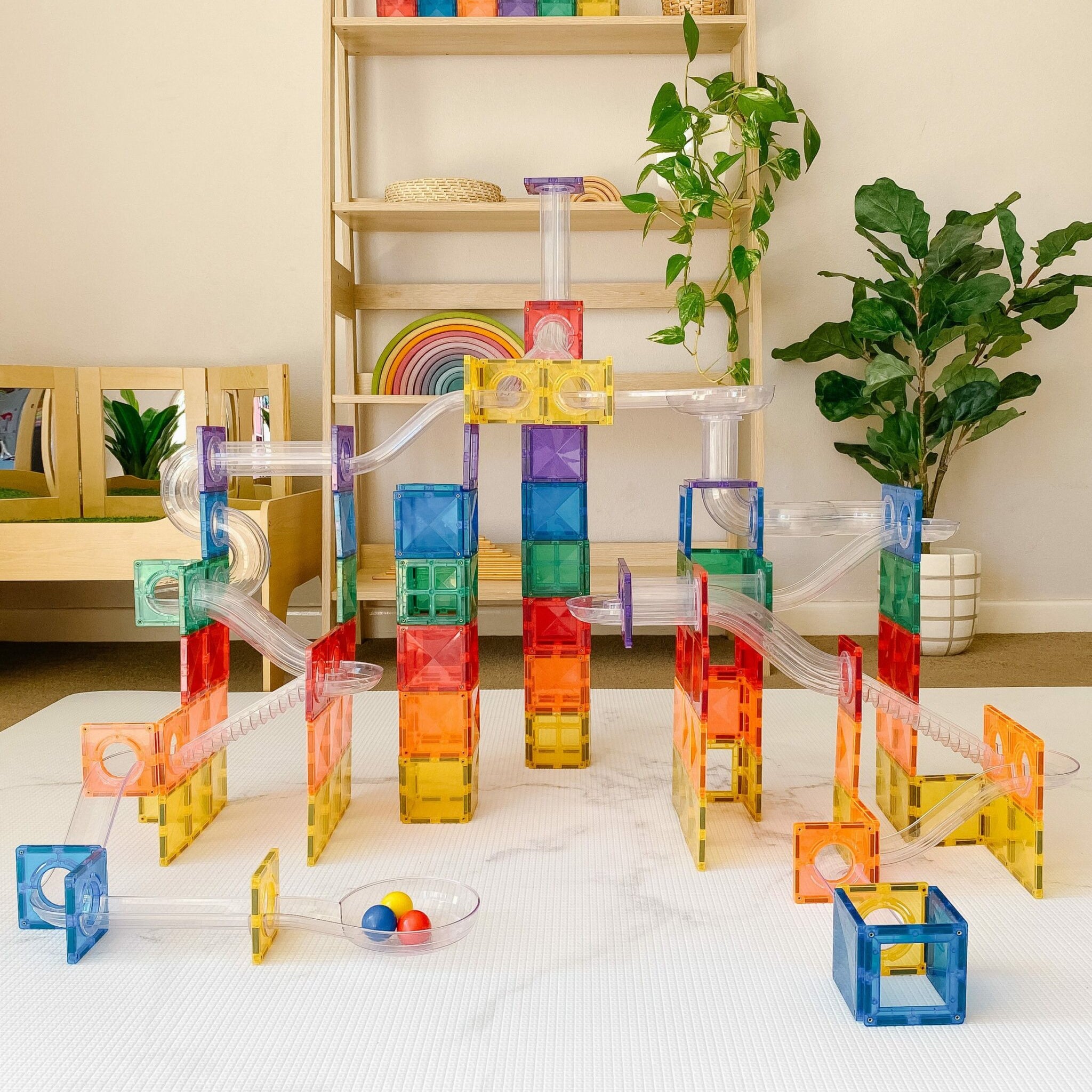 92 piece ball run set rainbow setup in a room