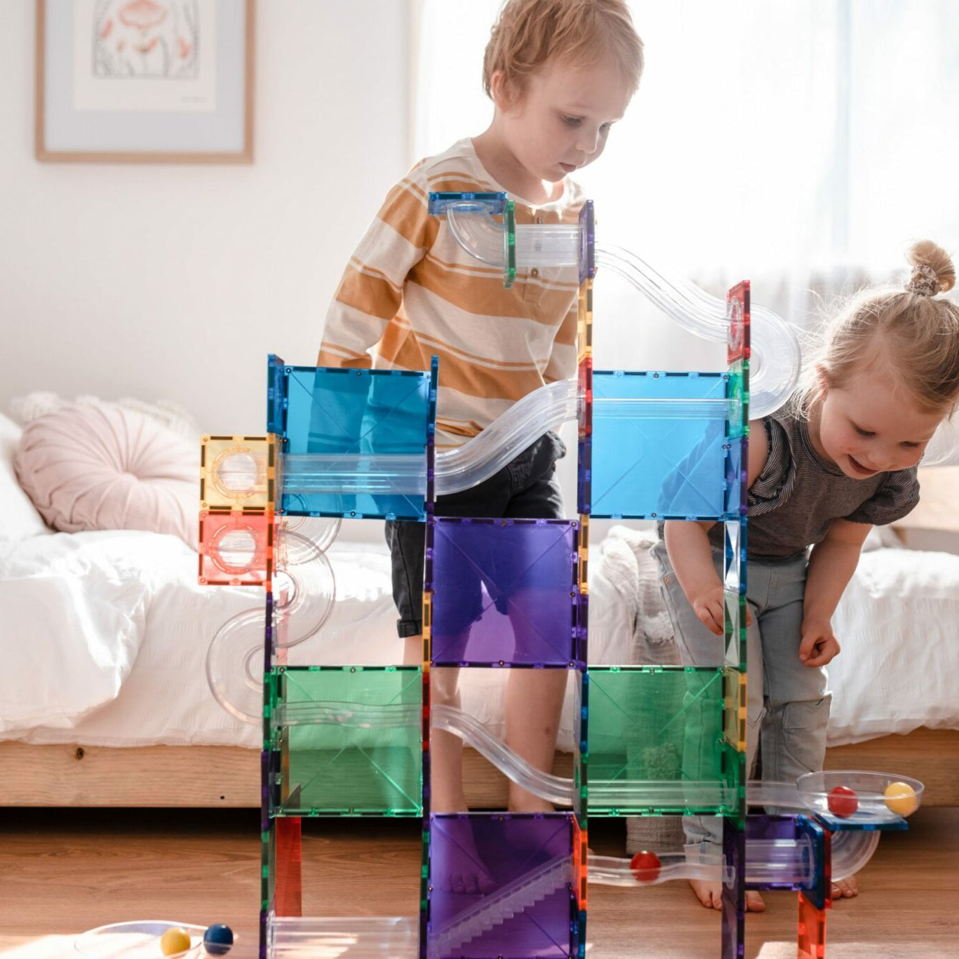 Kids playing with the 92 piece ball run set