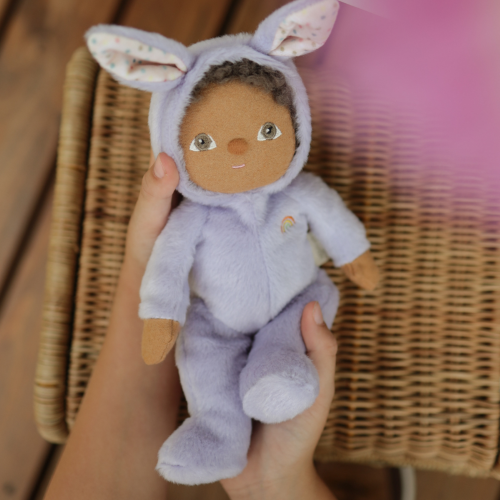 dinky dinkum babs bunny purple doll in someones hands