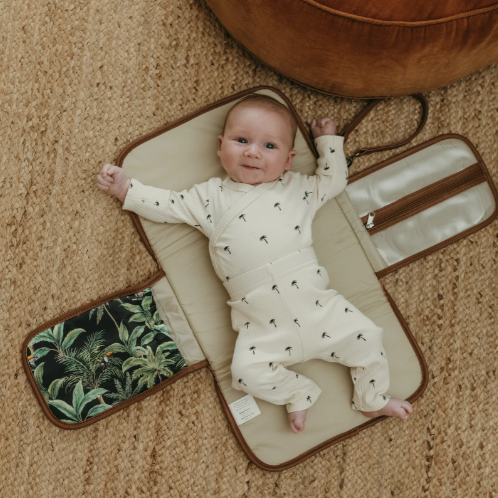 Change mat clutch with a baby on it