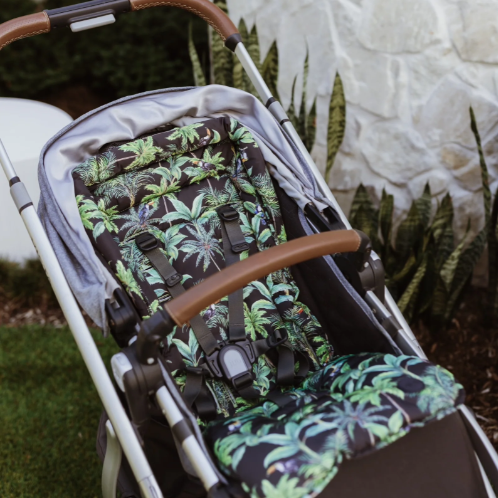 Pram seat liner in tropical on a pram