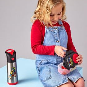 Girl with a water bottle and snackbox
