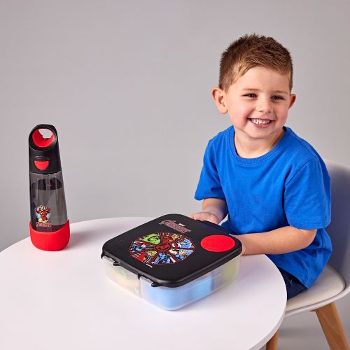 Little boy at the table with his waterbottle and lunchbox
