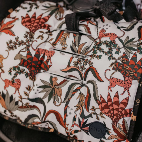 Pram seat liner in cream jungle close up