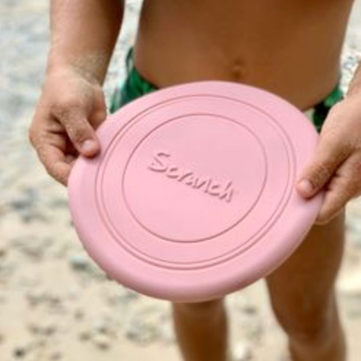 Kid holding a scrunch flyer