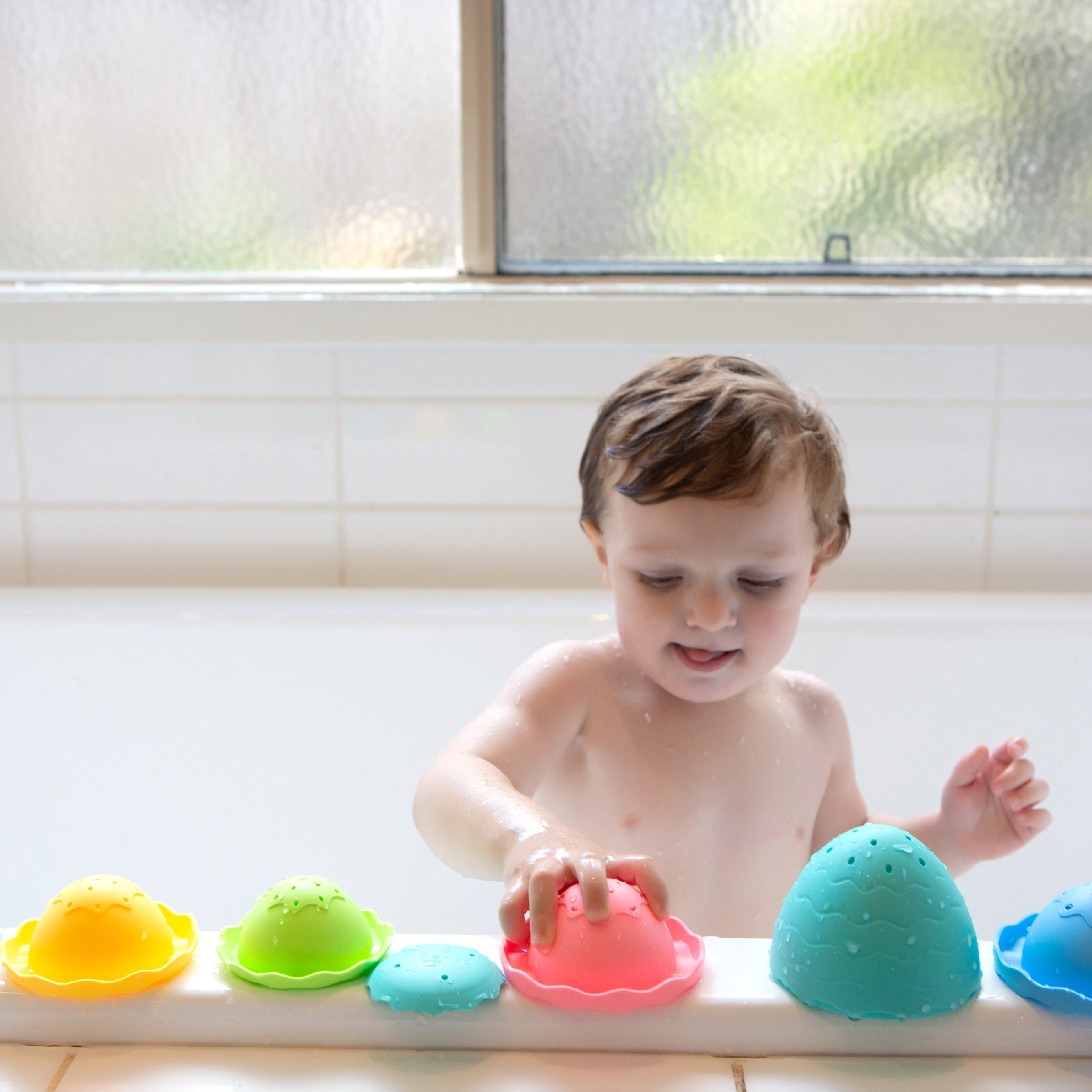 child Playing with the stack and pour egg