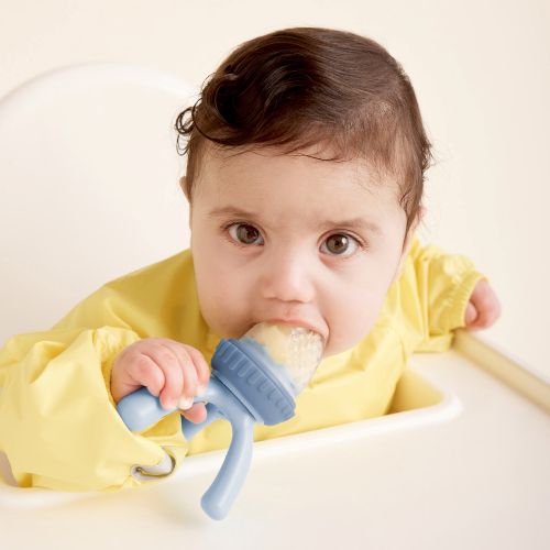 baby eating out of the silicone feeder
