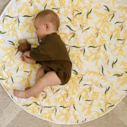 Baby on a wattle playmat