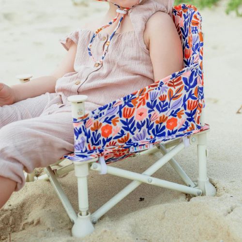 Toddler sitting in baby camping chair Izimini