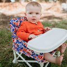 Baby sitting in willow baby camping chair Izimini