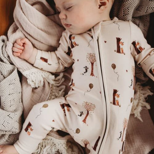Baby Sleeping wearing Bamboo zipsuit in autumn bear print