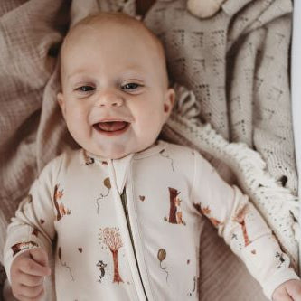Baby wearing bamboo zipsuit in autumn bear print