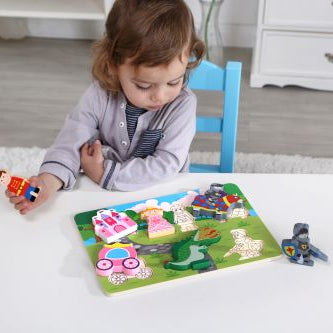 Child playing with a puzzle chunky princess