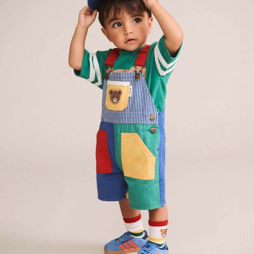 Toddler wearing the colour block overalls