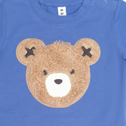 close up of the bear on the furry tee