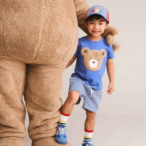 Boy wearing huxbear tee with a bear