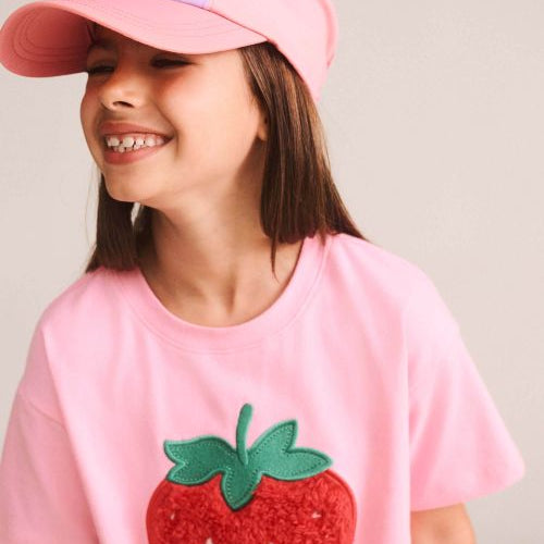 girl wearing the furry strawberry tee