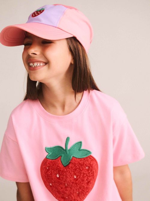 girl wearing the furry strawberry tee