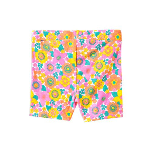 A pair of children's shorts featuring a vibrant, multicolor retro floral pattern with pink, yellow, orange, and green flowers on a white background.