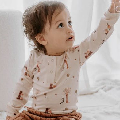 Toddler wearing Henley bodysuit in autumn bear print