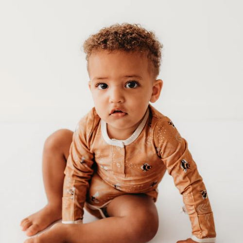 Toddler wearing Henley Bodysuit in bumble bees