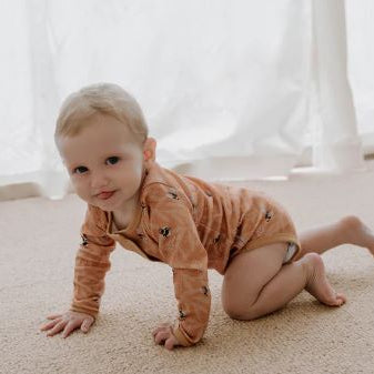 Baby Crawling wearing Henley bodysuit  in bumble bees
