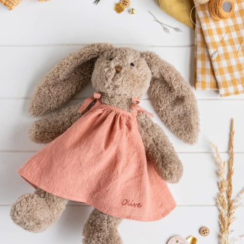 Mrs honey bunny in pink dress flatlay