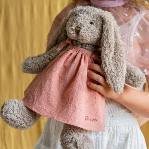 Mrs Honey bunny in pink dress being held by a little girl