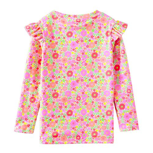 A long-sleeve children's top with a vibrant pink, orange, and green floral print, featuring ruffled shoulder details, shown against a plain white background.