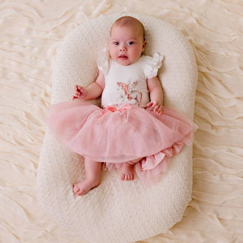 Baby wearing the sparkly pink tulle skirt