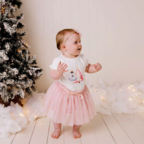 Girl wearing the sparkly pink tulle skirt