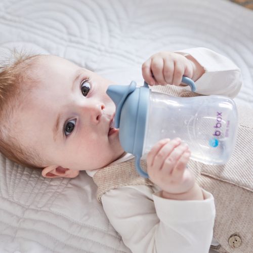 baby using spout cup in the color lullaby blue