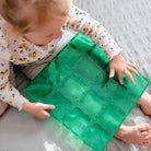 Child playing with the green base plate