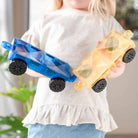 Child playing with the 2 piece car pack