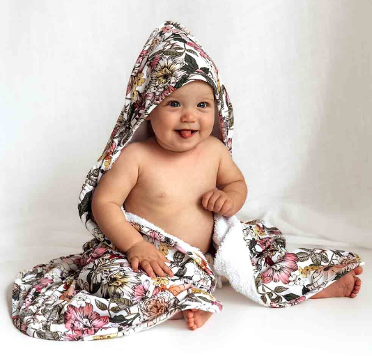 Baby using the australiana hooded towel