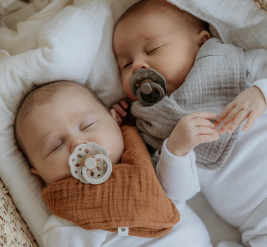 Babies using the Boheme bibs dummies