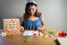 Girl playing with the botanical flower press