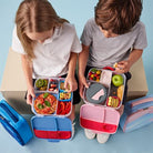 Children eating from there lunchboxes