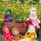 Happy harvest dinky dolls in a basket with vegetables