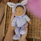 dinky dinkum babs bunny purple doll in someones hands