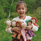 Little girl holding the dinky dinkum happy harvest collection