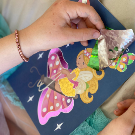 Child using the foil art fairy set