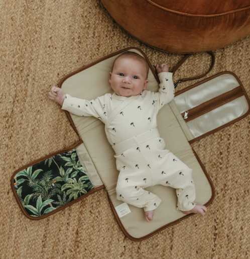 Change mat clutch with a baby on it