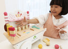 Girl playing with the icecream cart