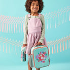 Little girl carrying the drink bottle and lunchbag