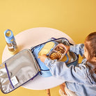 Child using the Bluey lunchbox while eating her lunch