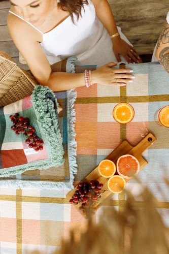 People using the solsse picnic rug throw as a table cloth