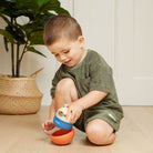 Boy playing with the rocking roller dog