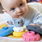 Baby playing with the silicone stacker koala