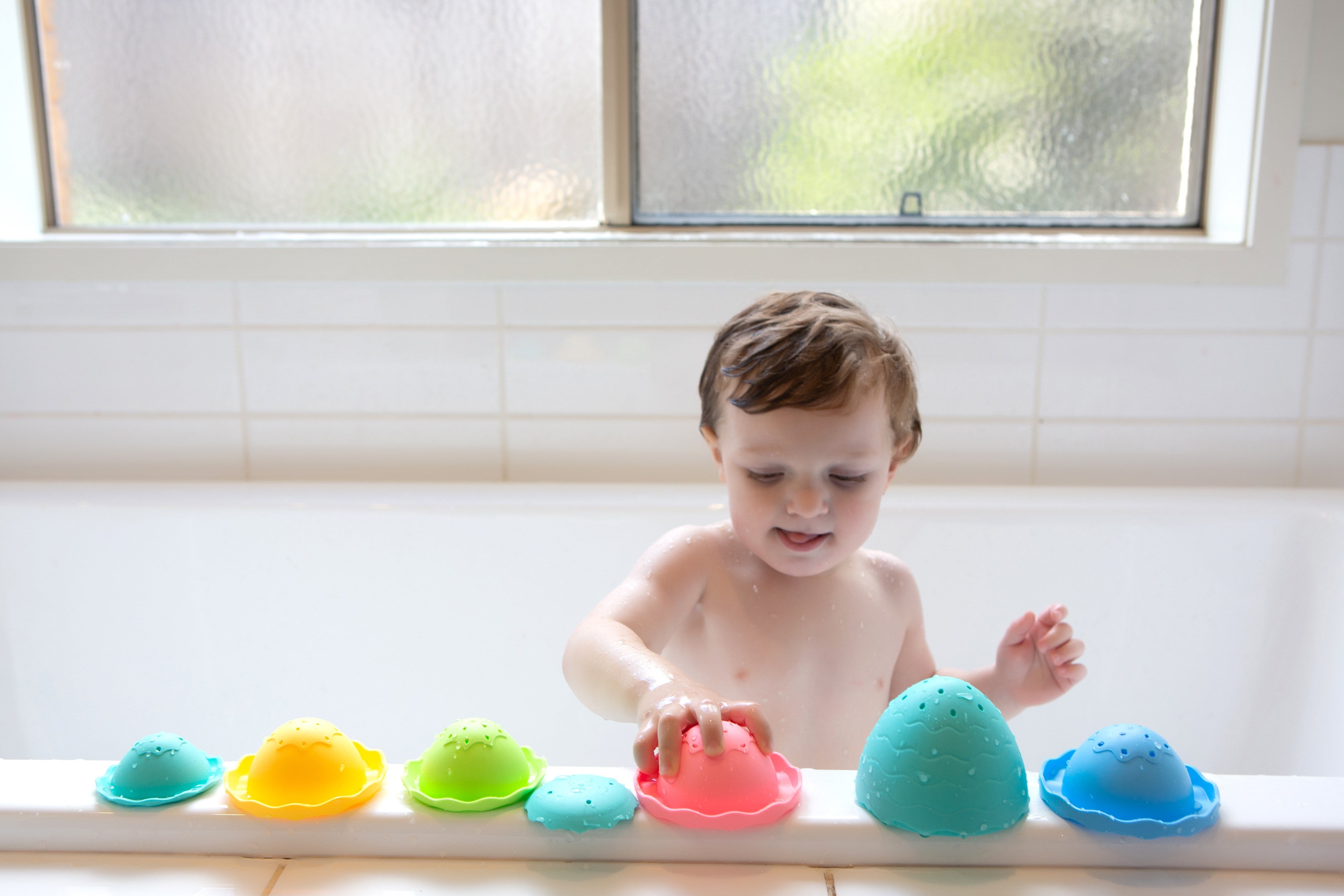 child Playing with the stack and pour egg